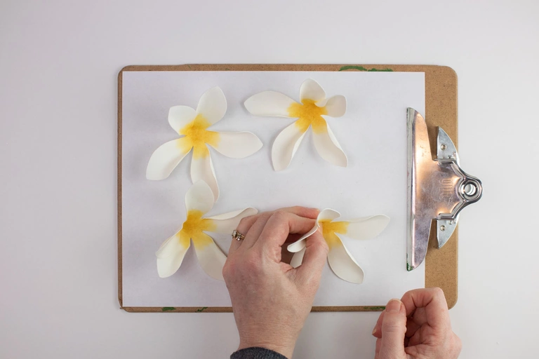 Making plumeria magnets.