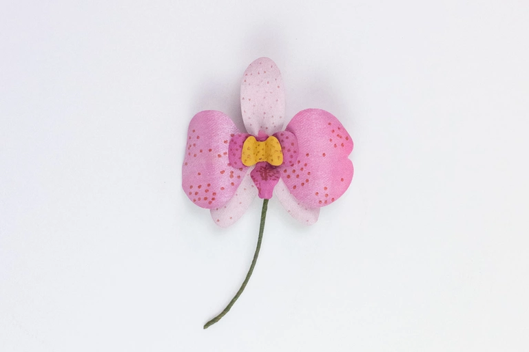 Orchid magnet made with shimmer paint.