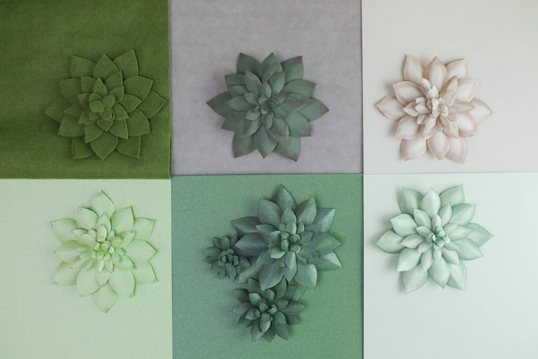 Various materials like felt, paper fabric, and cardstock used for making Forever-Plants.